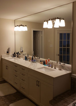 custom made wooden stool with glass seat placed over natural wood